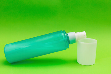 Washing foam, personal care products on a green background