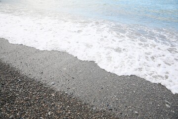 Picturesque view of beautiful sea wave on pebble beach