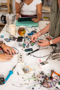 Stem project colleagues hands working on electronics 