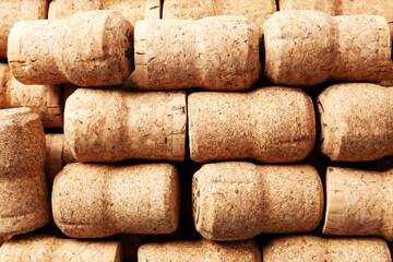 Many corks of wine bottles as background, top view
