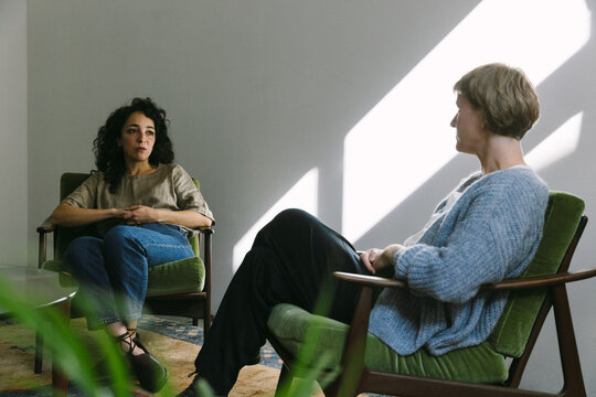 Female Psychotherapist Sitting in Silence With Female Client