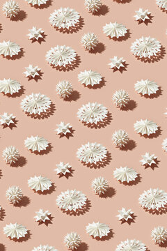 Pattern of white paper stars and snowflakes.