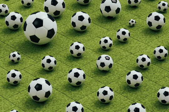 Several soccer balls on grass
