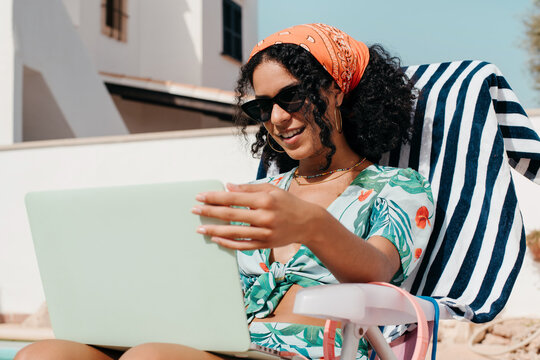 Woman Browsing Online On Her Laptop