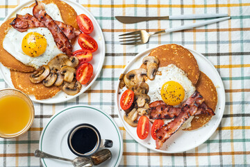 Breakfast with eggs, pancakes and bacon