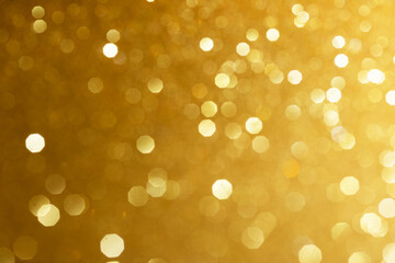 Golden glittering background for design and free space.