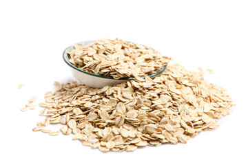Bowl full of raw oatmeal on white background