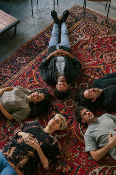 People Lying on Carpet During Group Therapy