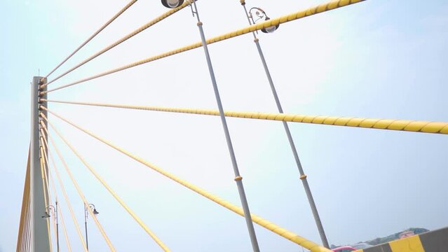 View of the cables of the Atal setu bridge at Goa in India as seen from a moving vehicle. Cable of cable bridge in goa. Bridge above the sea. Engineering background, view of cable from a car on bridge