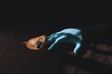 Halloween spooky blue hand and spider