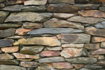 Old beautiful brick wall texture. Stacked Stone wall rock construction pattern. Marble wall texture background. Vintage brickwork backdrop