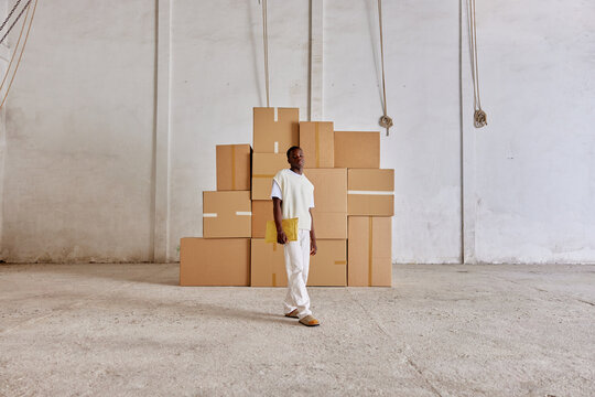 Storehouse worker with parcel