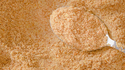 Fototapeta na wymiar Organic golden flaxseed meal close-up, full frame