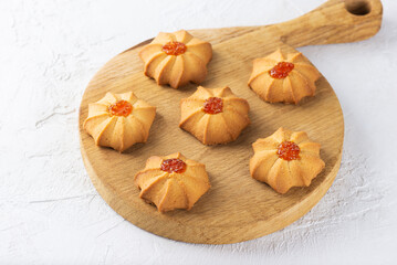 Shortbread kurabye. Sweet butter cookies for Chinese New Year on wooden board. 