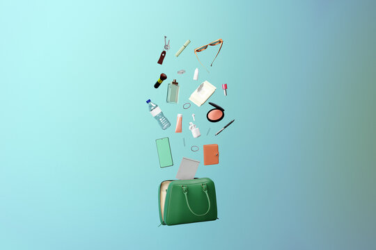 Feminine accessories coming out of a handbag. Purse contents