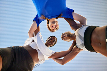 Teen football players huddling before match
