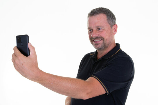 handsome man camera cell phone picture selfie with smartphone on white background