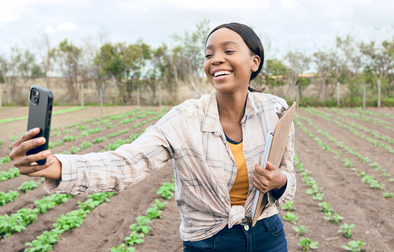 Black woman, farm and agriculture selfie with farmer in harvest field for farming and sustainability outdoor. Smile in picture, smartphone and clipboard for crop check and inspection, green and soil.