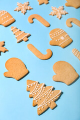 Set of tasty Christmas cookies on color background