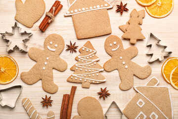 Composition with tasty Christmas cookies, spices and cutters on wooden background, closeup