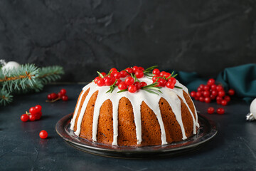 Traditional Christmas cake with cranberry on dark background