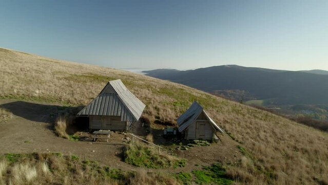 Aerial view of two mountain shelters in the Bieszczady National Park in Poland. Wooden cabin, off grid in Ż&oacute;łty Szlak Pieszy.