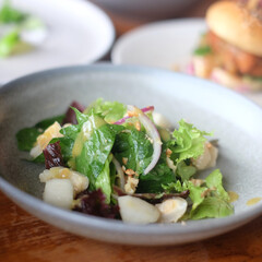 Healthy salad bowl with different lettuce, chicken, cheese and croutons on the table