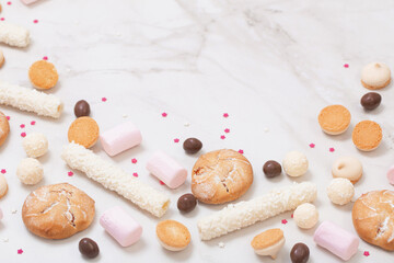 candies and cookies  on white marble background