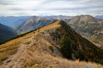 General view from Beaubarnon ridge overlooking the two valleys of Cristillan and Melezet above Ceillac, with mountain range in the background, Queyras Regional Natural Park, Southern Alps, France