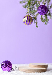 Wooden podium in the snow with festive decor on a light purple background. Christmas decoration...