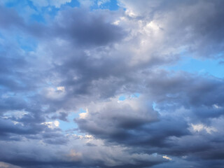 Thunderclouds on the blue sky