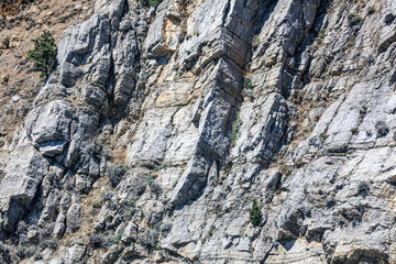 Stone rock in the mountains as an abstract background.