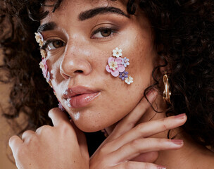 Beauty, flowers and makeup, portrait of black woman from Brazil with beautiful face on studio...