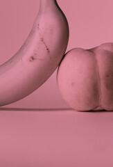 Still life of peach and banana with pink tone
