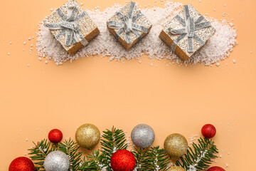 Composition with Christmas gifts, snow, fir branches and balls on color background