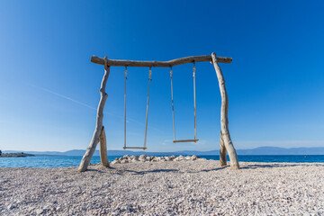 swinging into the sea