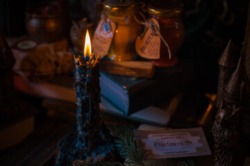 Illustration of magical stuff....candle light, magic wand, book of spells dark background, wizarding school, mystical aesthetic