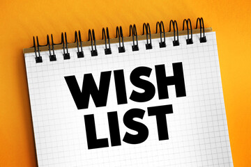 Wish List - itemization of goods or services that a person or organization desires, text concept on notepad