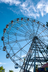 Khabarovsk, Russia, July 10, 2022: Ferris wheel on the Amur embankment in Khabarovsk against the blue sky
