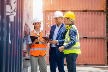 Worker and businessman checking containers data for export and import,Container loading Cargo freight ship.