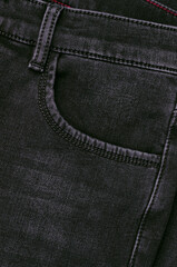 Part of dark jeans.