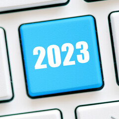 2023 year on the blue key of the computer keyboard.