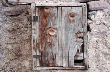 Closed Wood window on stone house