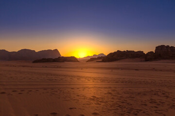 Wadi Rum, Jordan desert landscapeat sunset. The Valley of the Moon and UNESCO World Heritage Site.