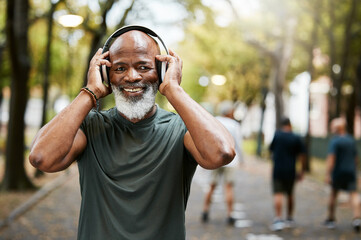Fitness, headphone and senior black man, music and exercise in nature park, portrait and running...