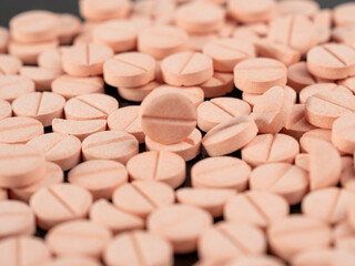 Lots of pink pills. Background from pink pills. medicine in tablets.