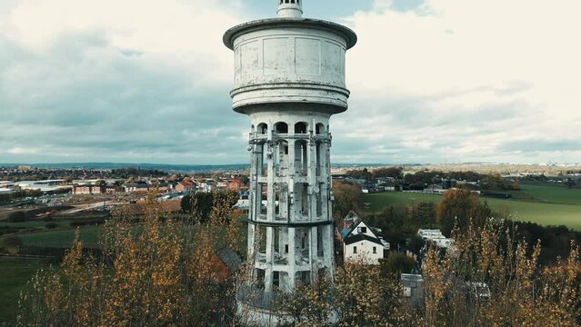 Aerial footage of the landmark known as Gawthorpe Water Tower from Chidswell Lane. The Gawthorpe Water Tower built in the 1920s and stands on one of the highest points in Osset, West Yorkshire, UK