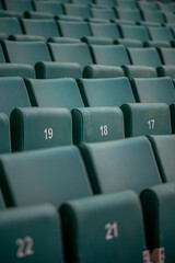 The empty seats of the stadium await match day