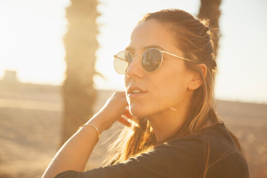 Young woman during sunset at Venice Beach, California