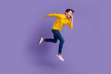 Fototapeta na wymiar Full body photo of handsome guy jumping high talking telephone rushing wear casual shirt isolated bright color background